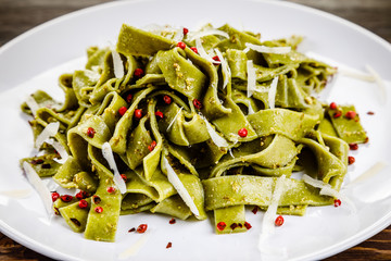 Pasta with cheese on wooden table