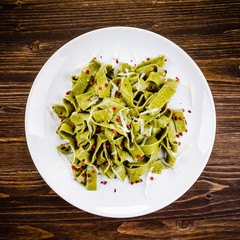 Pasta with cheese on wooden table