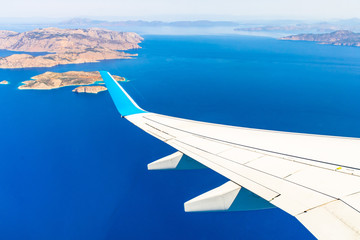 Aerial view of sea and greek islands with airplane wing - 222764495