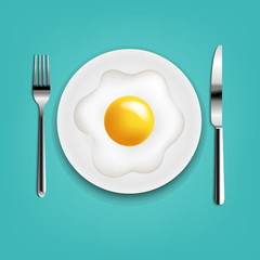 Plate With Fried Eggs Fork And Knife With Mint Cloth