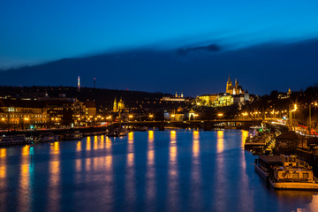 Obraz na płótnie Canvas Night panorama of Prague with lighted Prague Castle