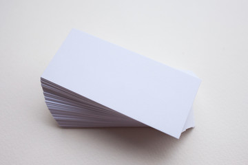 Empty business card template, cards in pile, isolated white background