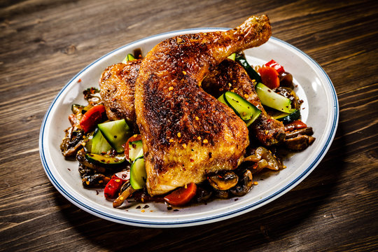 Barbecued chicken leg with vegetables
