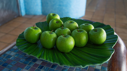 Green apples in a bowl inside a spa