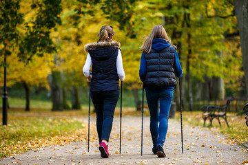 Nordic walking - active people working out in park