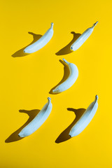 White banana on yellow background