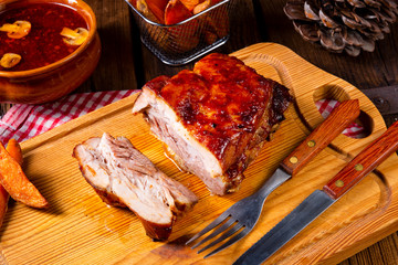 spicy roasted meat with mushroom sauce in the oven