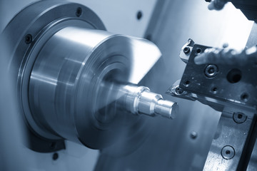 The  CNC lathe machine or turning machine  cutting the thread at the steel shaft.The threading...