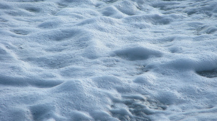 Sea foam, waves.