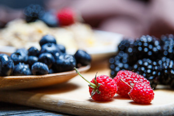 Berries mix blueberry, raspberry on rustic wooden table