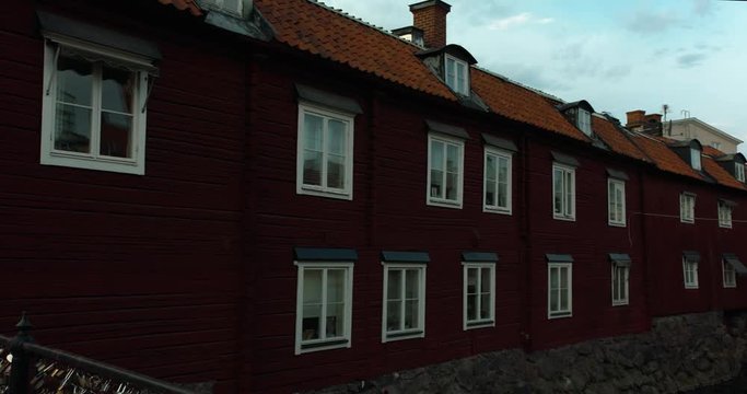 A panning shot of classic swedish red houses in central Västerås
