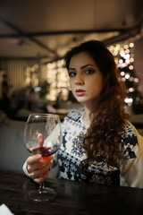 The girl in the evening rest in a cafe 