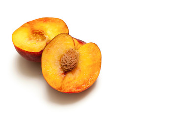 Naklejka na ściany i meble peach fruits with a stone isolated on white background