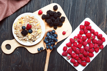 Cereal. Breakfast with muesli and berries. Top view, flat lay