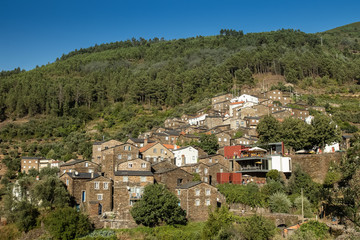 Fototapeta na wymiar The beautiful schist village of Piodão seen from the opposite hillside on a clear sunny day
