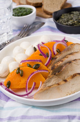 Pumpkin slices with meat and mozzarella