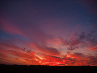 landscape of bright red sunset on a hot summer day