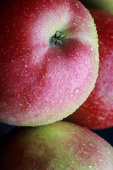 wet apples on a black background