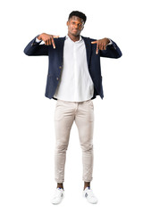 Full body of Handsome african american man wearing a jacket pointing down with fingers on white background