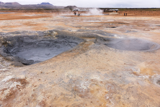 Gray hot mud pots in the Geothermal Area Hverir in Iceland