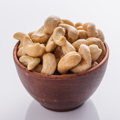 cashew nuts on a white acrylic background