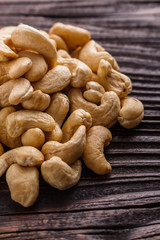 cashew nuts on a rustic wooden background
