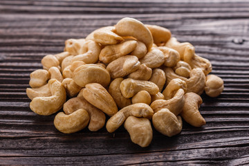 cashew nuts on a rustic wooden background