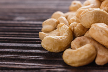 cashew nuts on a rustic wooden background