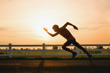 The man with runner on the street, running for exercise.