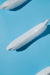 White banana on blue background
