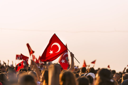 Turkish flag in crowded people.