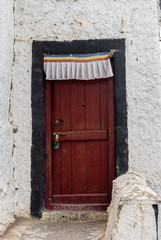 Old Red door of  Thiksey Monastery with Mountain background  in Summer Leh, Ladakh, Jammu and Kashmir, India
