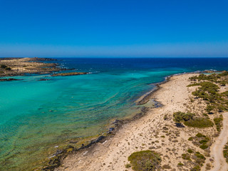 Aerial view to the beautiful beach and island of Elafonisi lagoon. Amazing wallpaper, photo from drone. Crete, Greece.