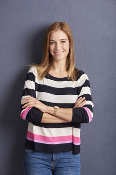 Smiling young woman studio portrait