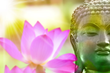 Buddha statue from Thailand.with lotus flower background,symbol of religion buddhism.design with copy space add text