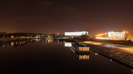 a bright office building by the river © Krzysztof Tabor