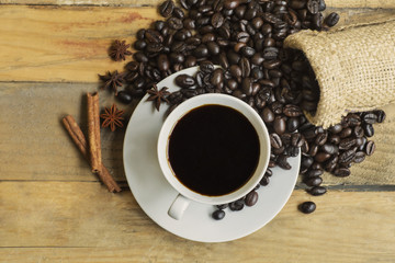 Coffee cup with spices and coffee beans