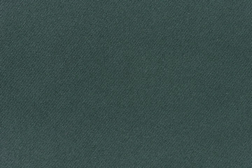 Dark green fabric background texture. Detail of linen textile material