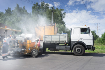 Road Construction. a lot of steam. application of road marking lines