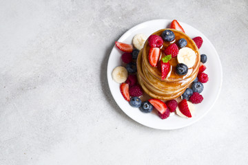 Delicious pancakes with fruit