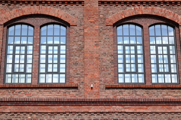Windows from an old red brick building