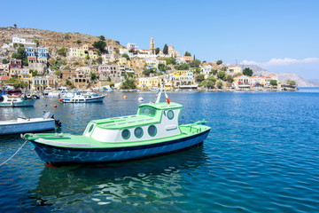Boat in Symi town harbor, Dodecanese islands, Greece