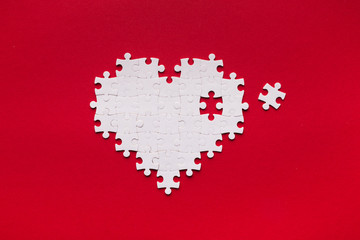 Puzzle heart with one missing piece, health care concept
