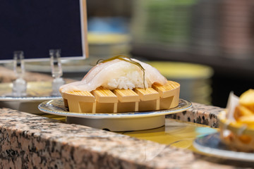 Close up of sushi in conveyor belt at sushi restaurant,Tokyo Japan