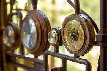 Closeup on a vintage dial meter with wood and copper