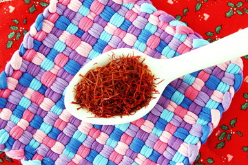 saffron in spoon for food and flavor extract concept,flat lay