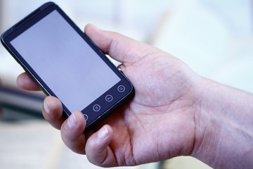 Cell phone in hand.