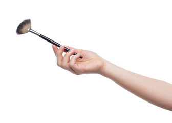 Cosmetic brush for makeup in female hand