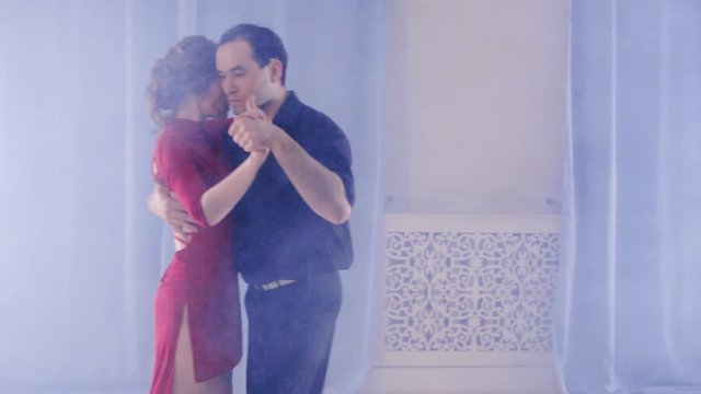 passionate couple dancing mambo