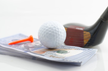 Golf ball and dollars, is the world's number one business